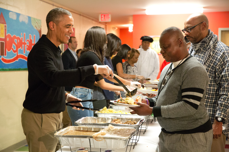 Then-President Barack Obama and family serve Thanksgiving meals to homeless and at-risk veterans at Friendship Place in Washington, D.C., on Nov. 25, 2015. Earlier in the day, Obama participated in the annual turkey pardon at the White House. (Martin H. Simon-Pool/Getty Images)